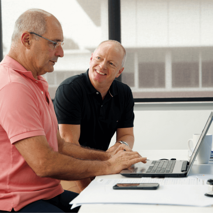 Adam and Roger from RQC Group discussing business